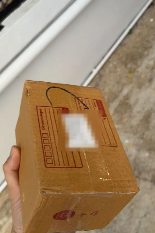 A plain cardboard delivery box with no brand names on it